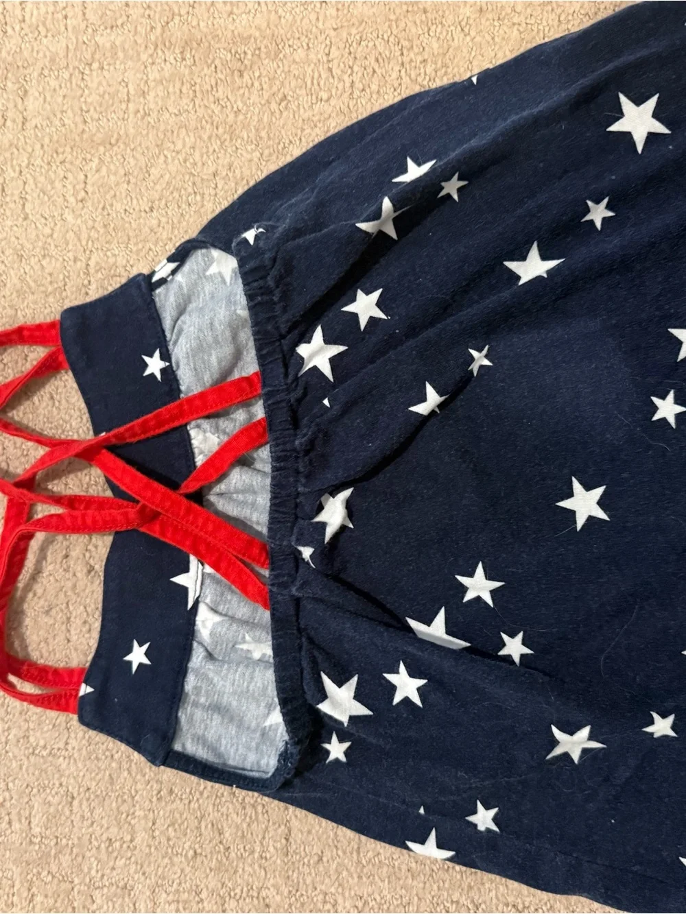 2 toddler tanks: plaid Oshkosh, star Carters